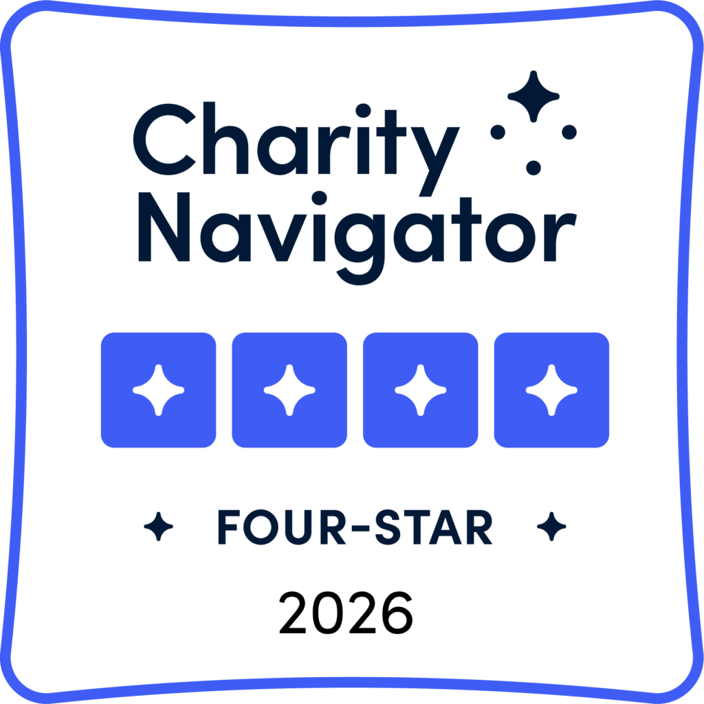 Charity Navigator branding with four star icons and the text 'FOUR-STAR' on a white card background, 2026 nearby.